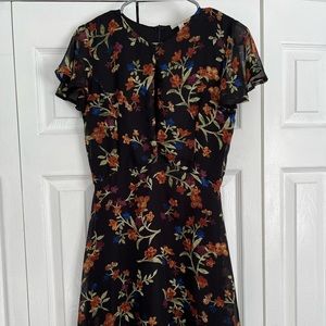 CLEARANCE:  Black/Floral dress with deep slit on chest.